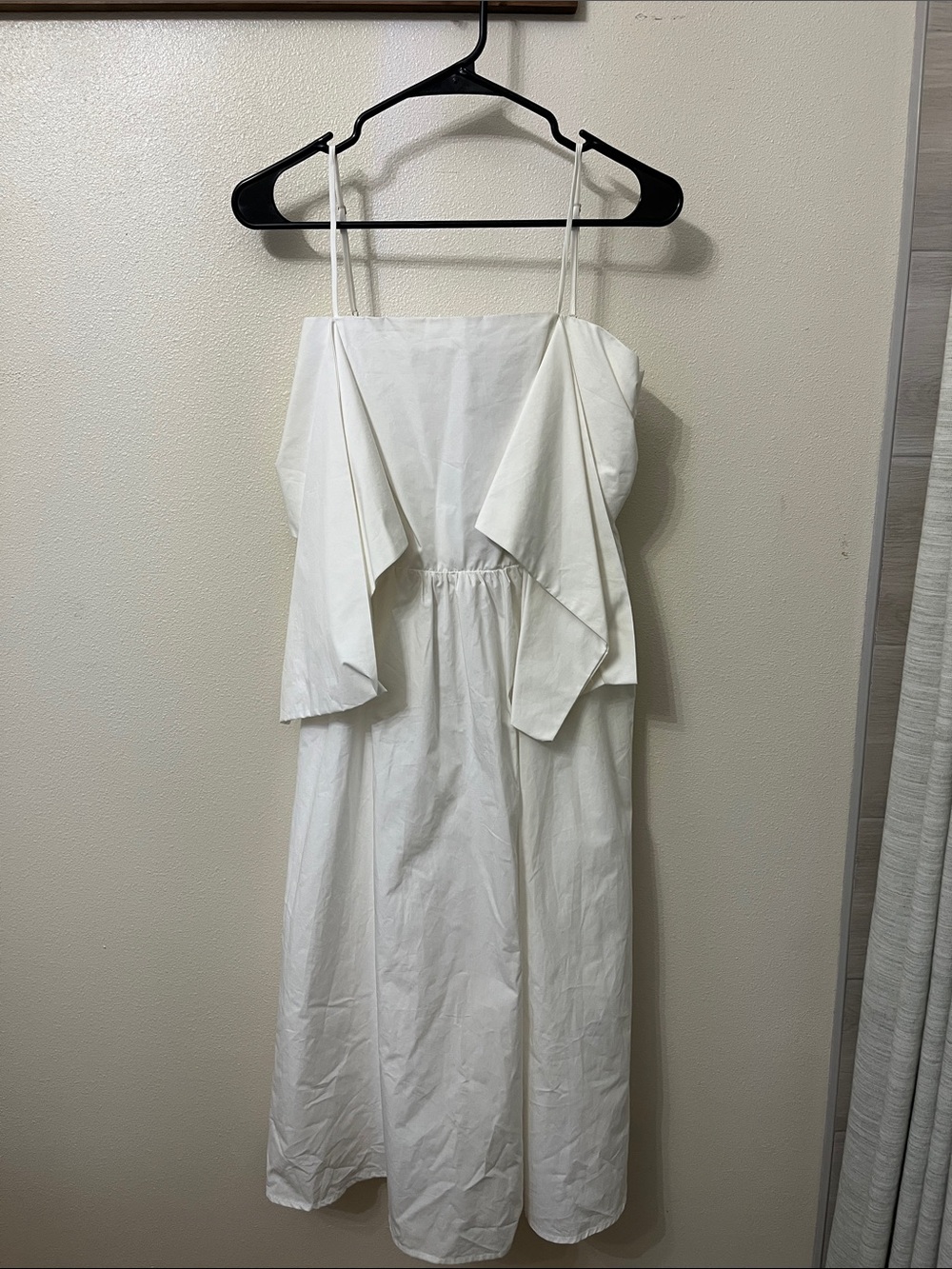 Cavendar’s MainStrip White Spaghetti Strap Midi Dress with Draped sleeves